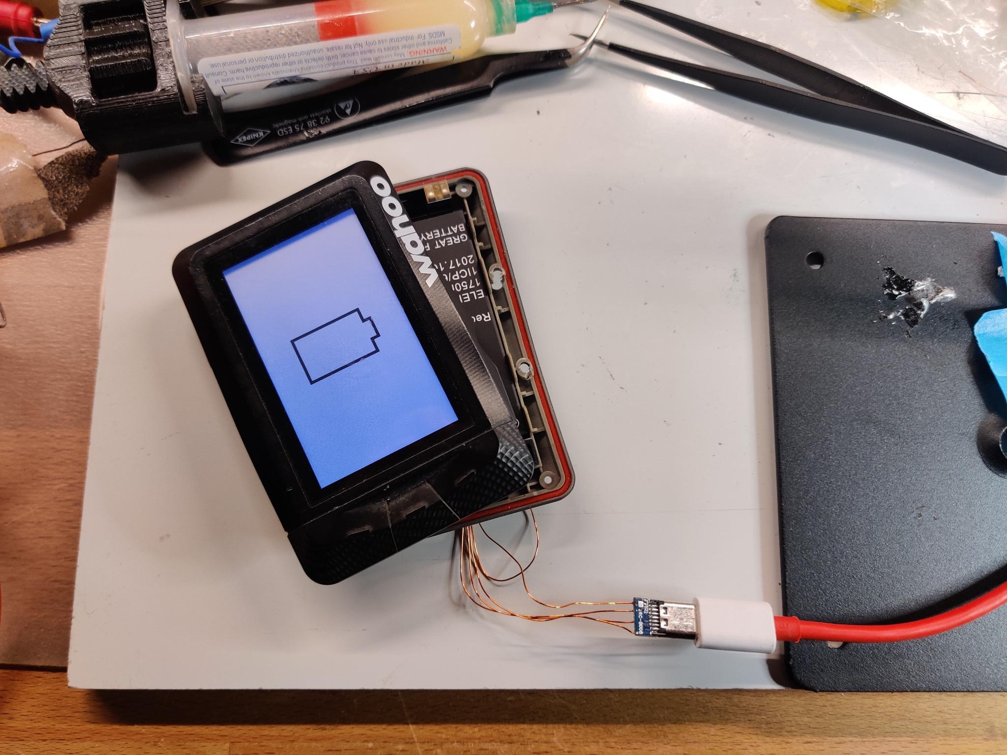 Disassembled Wahoo ELEMNT charging after repair