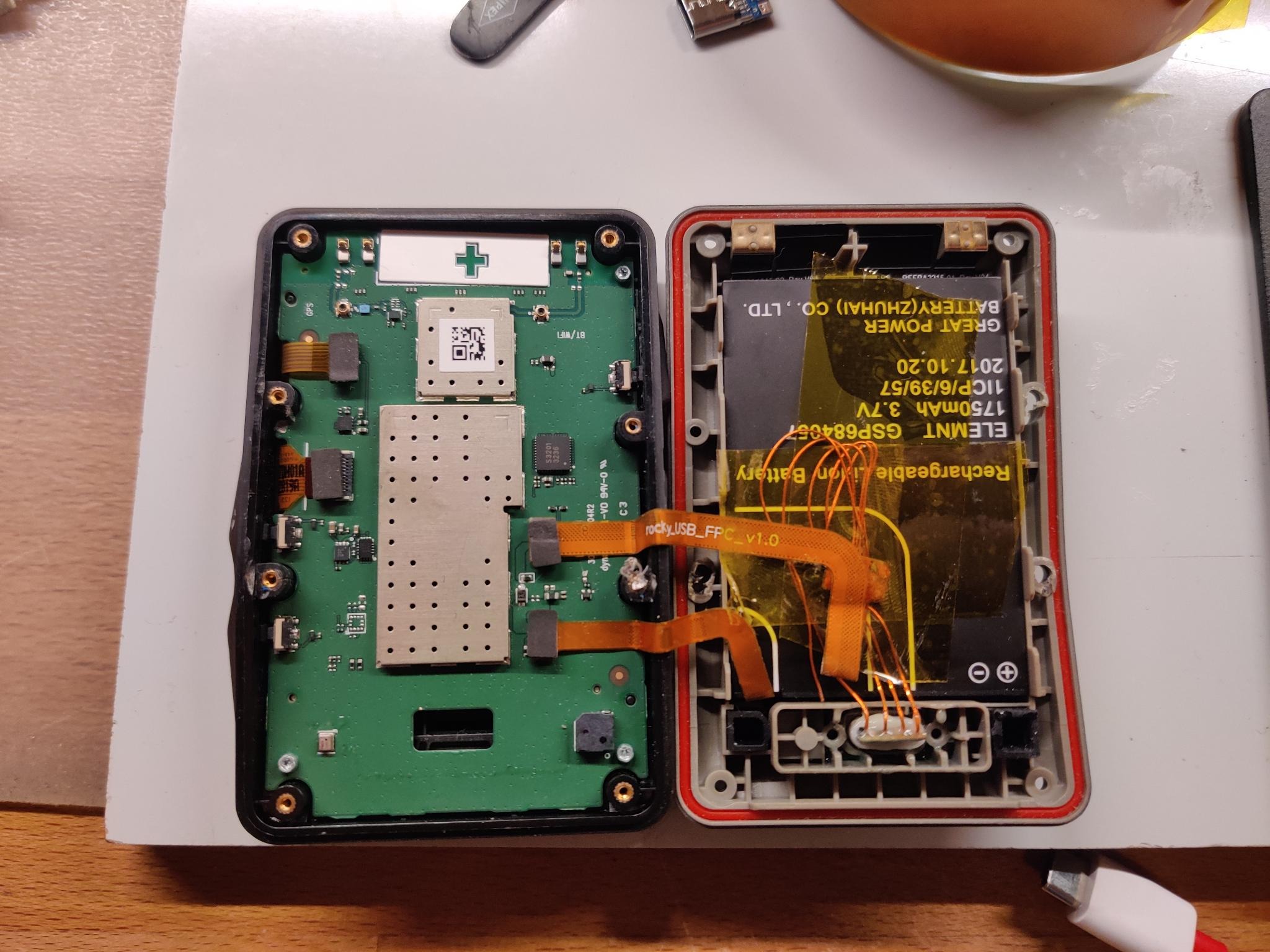 Opened up Wahoo ELEMNT showing the repaired flat flex cable